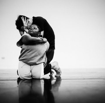 A black and white photo of dancers Mo and Christian during a duet.