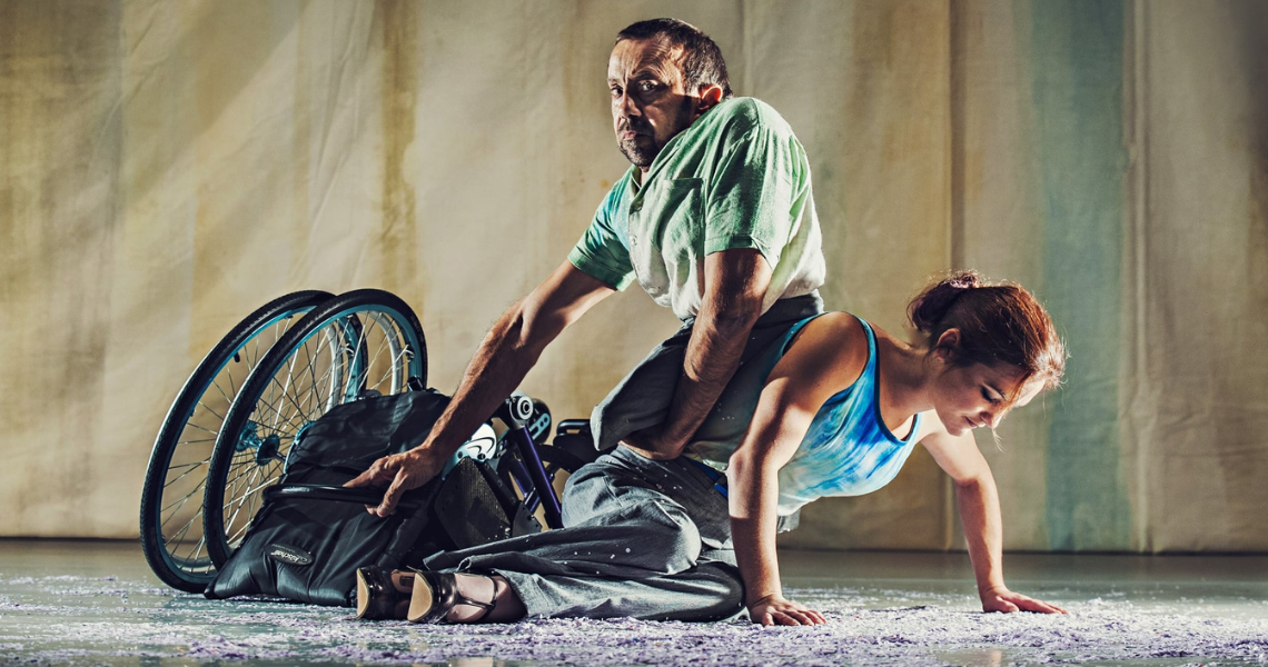 Dave Toole sits on Laura Jones, next to her collapsed wheelchair.