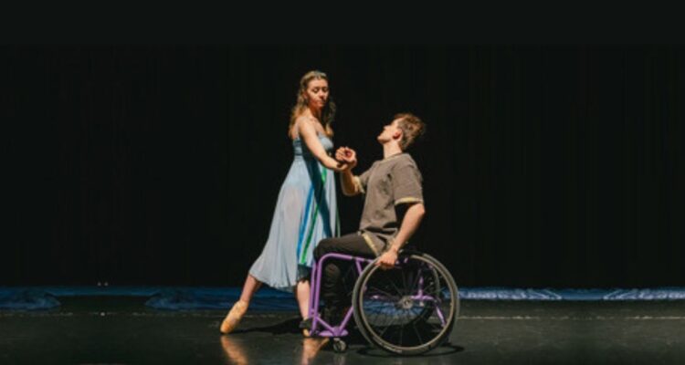 Wheelchair ballet dancer and standing ballet dancer