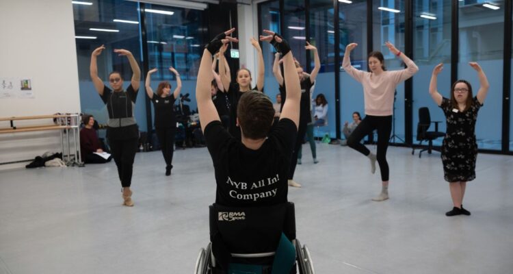 a wheelchair dancer leading others