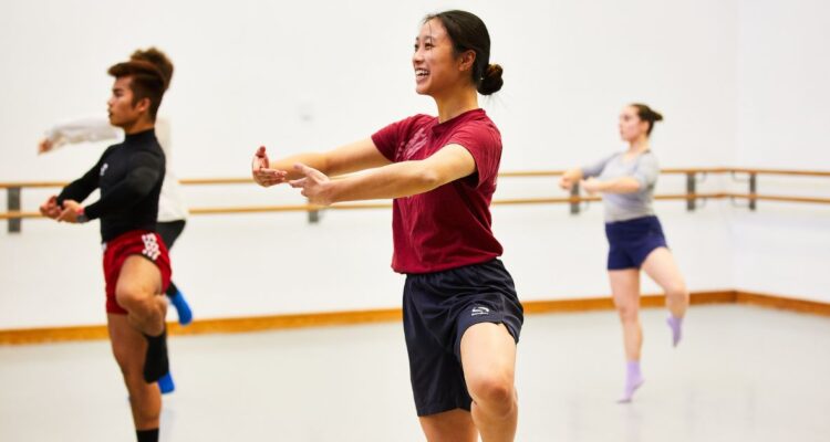 3 dancers in a bright studio