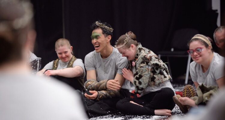 Learning Disabled and non-disabled dancers laughing together