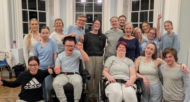 A group photo of Disabled and non-disabled people